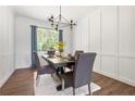 Elegant dining room featuring a modern chandelier and hardwood floors at 145 Mahogany Ct, Cameron, NC 28326