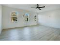 Bright living room featuring hardwood floors and ceiling fan at 189 Zenobia Ave, Lillington, NC 27546