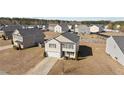 Expansive aerial view showcasing a well-maintained two-story home in a residential neighborhood at 539 Botanical Ct, Bunnlevel, NC 28323