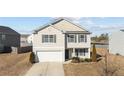 Traditional two-story home with a two-car garage, offering a classic and inviting facade at 539 Botanical Ct, Bunnlevel, NC 28323