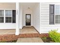 Front entry with covered porch and brick steps at 136 Parkview Ln, Lillington, NC 27546