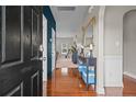 Bright entryway with hardwood floors and a view into the living area at 192 Rosslyn Chapel Ln, Cameron, NC 28394