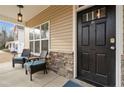 Front porch with stone accents and seating area at 192 Rosslyn Chapel Ln, Cameron, NC 28394