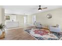 Bright living room with hardwood floors, stylish rug and two armchairs at 231 Faith Church Rd, Four Oaks, NC 27524