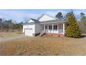 Lovely single Gathering home with a covered front porch and an attached two car garage at 240 Colonial Hills Drive Dr, Lillington, NC 27546