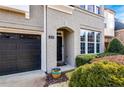 Front entrance of a two-story home with gray brick and a black door at 4008 Windflower Ln, Raleigh, NC 27612