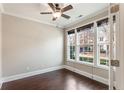 Bright home office with hardwood floors, neutral walls, and large windows at 4008 Windflower Ln, Raleigh, NC 27612