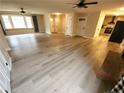 Spacious living room with new flooring and fireplace at 128 Highland Dr, Lillington, NC 27546
