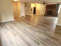Large living room with hardwood floors and access to kitchen at 128 Highland Dr, Lillington, NC 27546