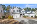 Two-story house with gray siding, white trim, and a two-car garage at 597 Micahs N Way, Spring Lake, NC 28390