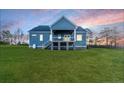 Back view of house, showing deck and large yard at 2477 Sheriff Watson Rd, Sanford, NC 27332