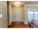 Bright foyer with hardwood floors and coat hooks at 2817 Carolina Way, Sanford, NC 27332