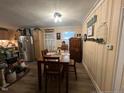 Cozy dining area adjacent to the kitchen, featuring a wooden table and chairs at 305 W K St, Erwin, NC 28339