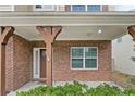 Inviting front porch with brick columns, offering a cozy entrance to the home at 323 River Oak St, Spring Lake, NC 28390