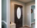 Inviting foyer with a decorative front door and a view into other rooms of the home at 86 Carolina Oaks Cir, Linden, NC 28356