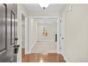 Inviting entryway with hardwood floors transitioning to carpeted living space at 90 Orchard Falls Dr, Spring Lake, NC 28390