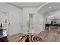 Inviting foyer showcasing hardwood flooring, natural light, and access to the home's living spaces at 15 Glenwood Ct, Spring Lake, NC 28390