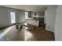 Unfinished kitchen with an island and cabinets, prepped for final installation at 288 Rocking Horse Ln, Sanford, NC 27332