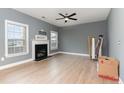 Cozy living room featuring hardwood floors and a modern fireplace at 638 Century Dr, Cameron, NC 28326