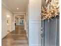 Bright foyer with hardwood flooring and views into the living spaces at 87 Education Dr, Spring Lake, NC 28390