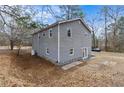 Exterior of home showing backyard and gray vinyl siding at 4454 Wire Rd, Linden, NC 28356