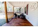 Covered porch featuring stained wood floors and furniture at 476 Riddle Rd, Sanford, NC 27330