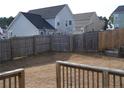 Fenced-in backyard with a wood fence and view from a wood deck at 96 Boston Hbr, Cameron, NC 28326