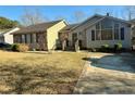 View of a one-story home with mixed stone and vinyl siding plus a concrete driveway at 1501 Homestead Rd, Rocky Mount, NC 27804