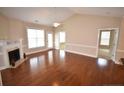 The large living room features hardwood floors, a fireplace, and a ceiling fan at 159 Gallery Dr # 201, Spring Lake, NC 28390
