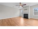 Bright living room featuring hardwood floors, a fireplace, large windows and a ceiling fan at 262 Shepard Dr, Linden, NC 28356