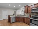 Kitchen featuring stainless steel appliances, granite countertops, and wood cabinets at 31 White Tail Path, Erwin, NC 28339