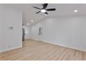 Bright open living space featuring light-colored floors, ceiling fan, and neutral wall paint, ideal for customization at 5802 Lillie Dr, Durham, NC 27712