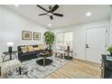 Living room featuring neutral colors, contemporary furnishings, and vaulted ceilings at 5802 Lillie Dr, Durham, NC 27712
