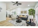 Bright living room features a vaulted ceiling, stylish decor, and lots of natural light at 5802 Lillie Dr, Durham, NC 27712