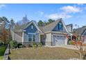 Charming single-Gathering home with a well-manicured lawn and attached two-car garage at 159 Glenwood Ct, Spring Lake, NC 28390