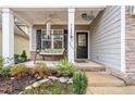 Inviting front porch with a cozy swing, perfect for relaxing and enjoying the outdoors at 929 Micahs N Way, Spring Lake, NC 28390