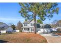 Charming two-story home with a well-maintained lawn and a two-car attached garage at 126 Ribbon Oak Court Ct, Sanford, NC 27332