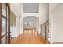 Grand foyer featuring gleaming hardwood floors and a staircase with iron balusters at 127 Skipping Water Dr, Spring Lake, NC 28390