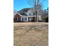 Charming two-story home with brick and vinyl siding and covered porch at 1508 Westfall Cir, Sanford, NC 27330