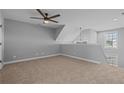 Spacious bedroom featuring neutral carpeting, fan and natural light from a window at 165 Mahogany Ct, Cameron, NC 28326