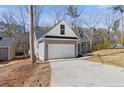 The home features an attached two car garage and long driveway at 1824 Irish Blvd, Sanford, NC 27332