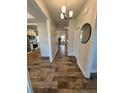 Hallway featuring wood floors and providing access to the kitchen and other living spaces at 38 Cedarview Ct, Cameron, NC 28326