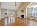 Spacious living room featuring high ceilings, a fireplace, and access to outdoor space at 147 Lamplighter Way, Spring Lake, NC 28390