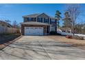 Lovely two-story home with a long driveway, attached garage, and blue shutters against the siding at 37 Annapolis Rd, Cameron, NC 28326