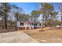 Charming single-story home with a welcoming front porch and well-maintained lawn at 14 Brafford Estates Dr, Cameron, NC 28326