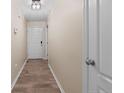 Entryway with wood-look floors, neutral walls, white trim, and a flush mount light fixture at 140 Cobblestone Dr, Spring Lake, NC 28390