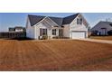 A well-maintained home with a sprawling front lawn at 199 Carolina Oaks Dr, Linden, NC 28356