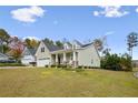 Inviting exterior featuring a well-manicured lawn and charming architectural details at 10 Glenside Ct, Spring Lake, NC 28390