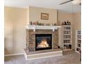 Cozy living room features a stone fireplace, built-in shelving, creating a warm and inviting space at 109 Mosby Ln, Spring Lake, NC 28390