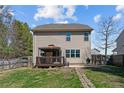 Backyard with a deck, gazebo, fenced-in yard, and a grassy area at 220 Pender Rd, Spring Lake, NC 28390